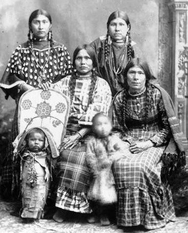Vintage studio portrait of four women with two small children